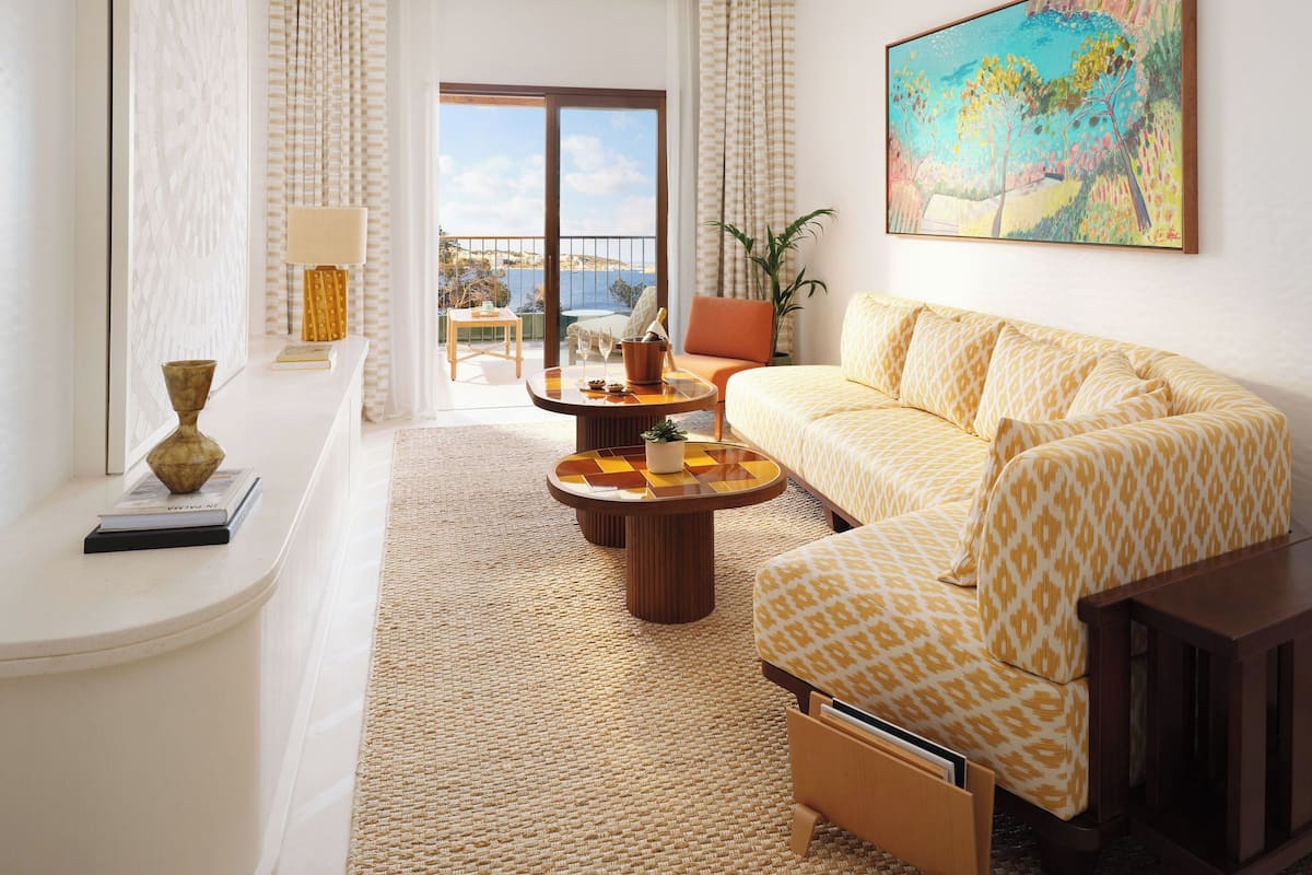 Deluxe Suite, Sea View | Living area | 50-inch LED TV with cable channels