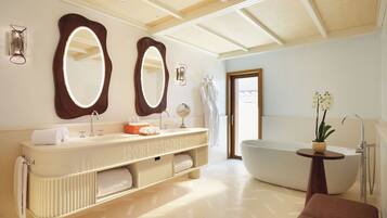 A modern bathroom with a freestanding bathtub, a large vanity with two mirrors, and a towel rack.