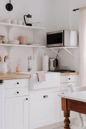Fridge, microwave, stovetop, coffee/tea maker