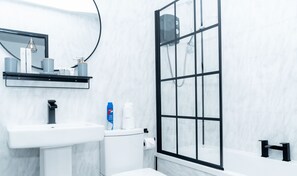 Shower, hair dryer, towels