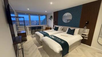 1 bedroom, desk, iron/ironing board, bed sheets