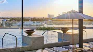 Outdoor pool, open 7:00 AM to 10:00 PM, cabanas (surcharge)