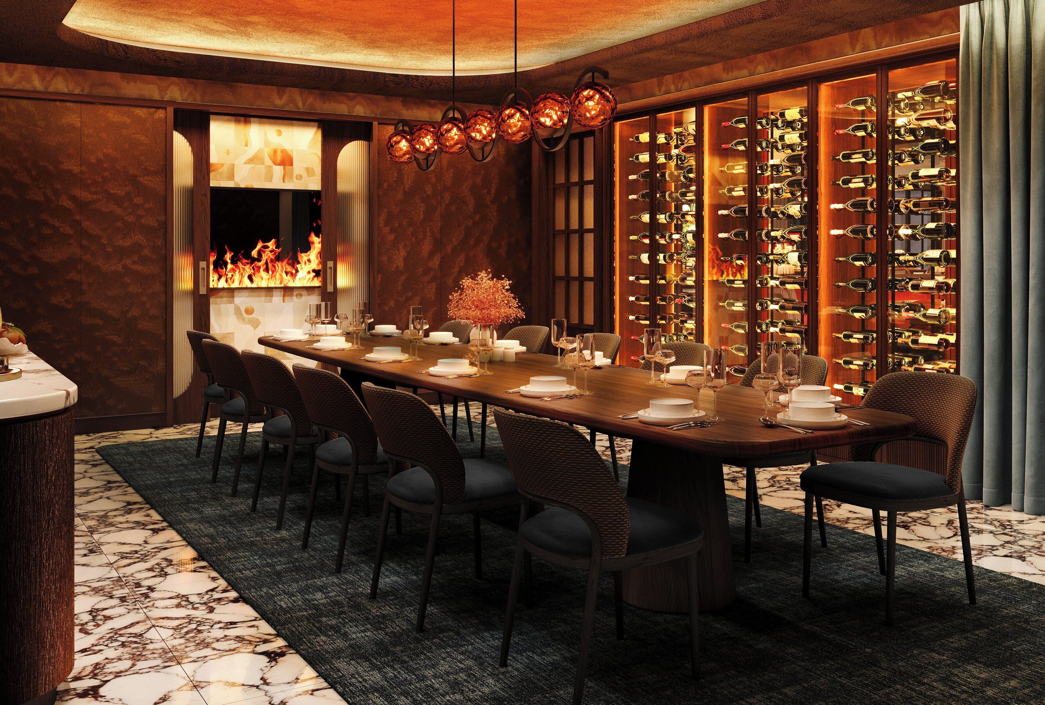 Un comedor elegante con una larga mesa, sillas, una estantería para vinos y una chimenea.