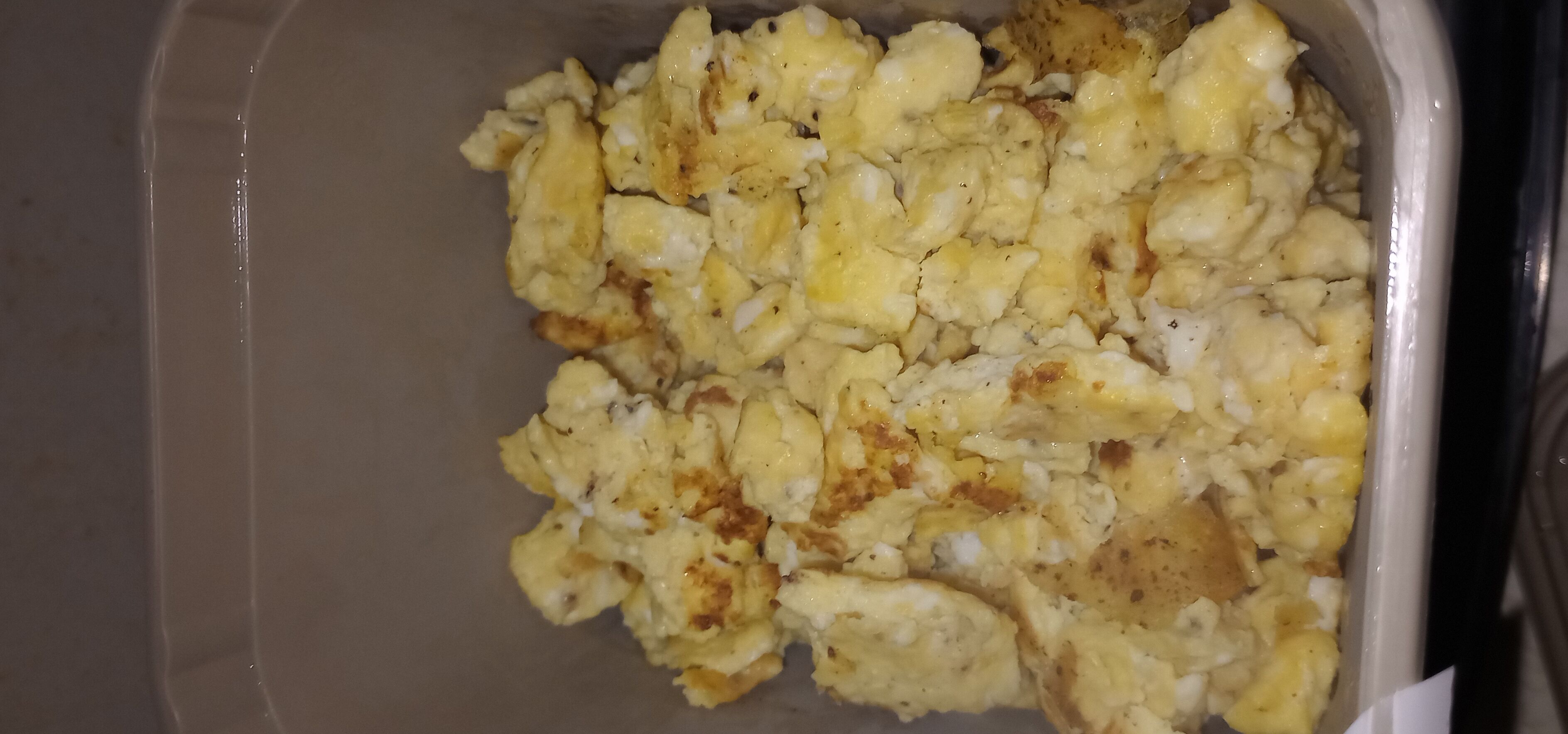 A container of scrambled eggs.
