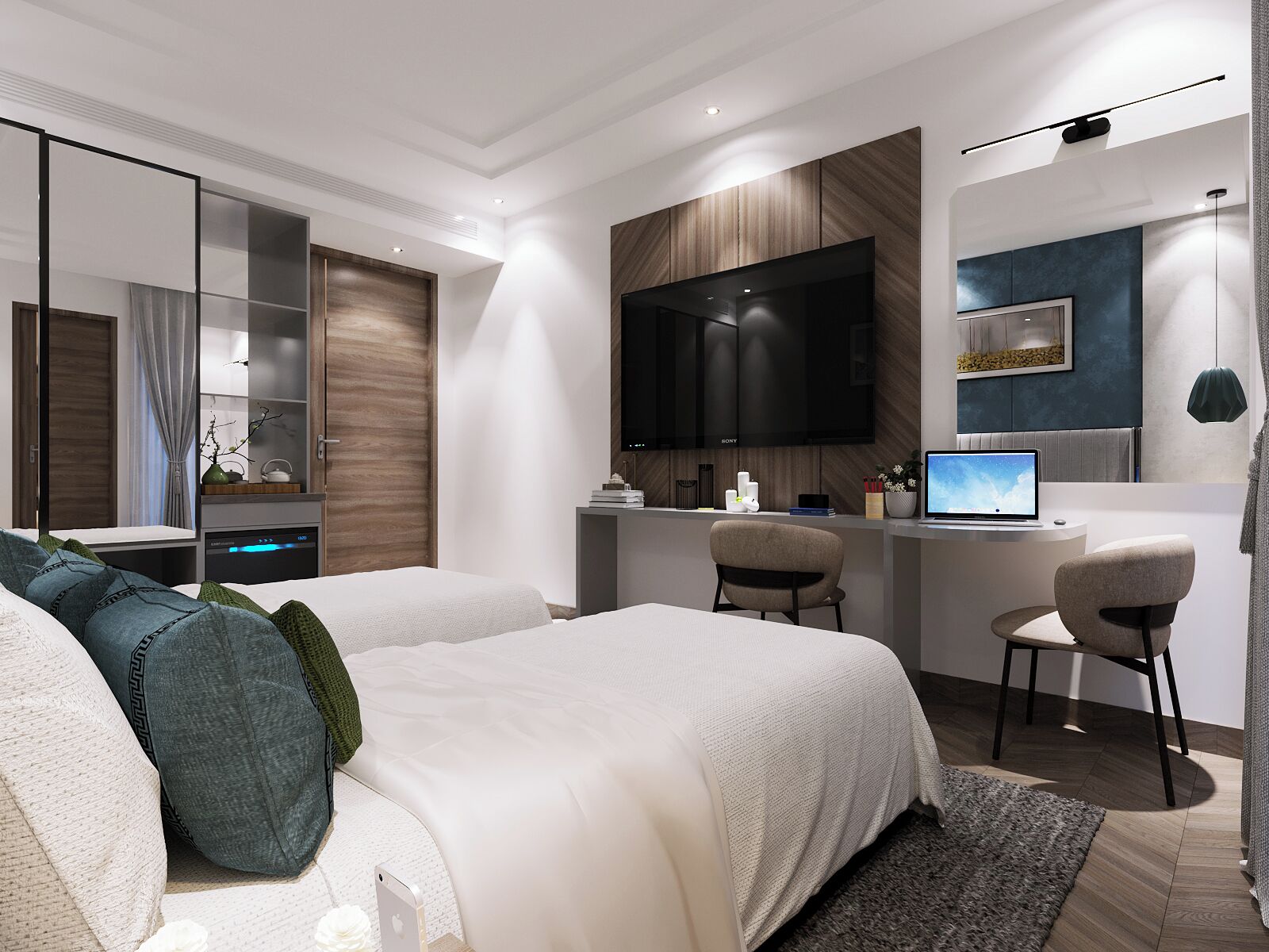 A modern hotel room with a large bed, a desk with a laptop, a flat-screen TV, and a seating area with chairs.