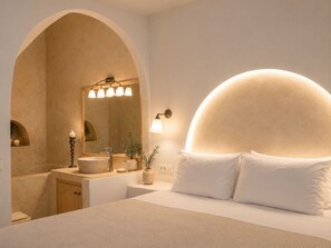 Classic Suite with Caldera View and Shared Pool | Bathroom | Shower, hair dryer, slippers, towels - Lava suites (Fira)