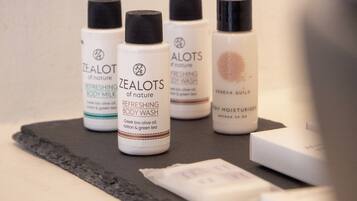 A selection of skincare products on a dark surface.