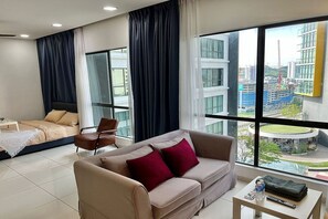 Superior Studio, 1 Queen Bed, Balcony, City View | Living area | 30-inch TV with cable channels