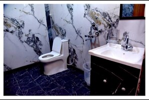 Shower, towels, soap, toilet paper