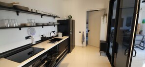 Deluxe Apartment, 2 Bedrooms, Patio, Garden View | Private kitchen | Espresso maker, coffee/tea maker, electric kettle, dining tables