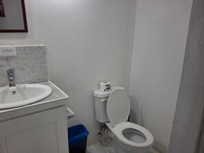 Signature Apartment, Garden View | Bathroom | Hair dryer, towels, soap, toilet paper