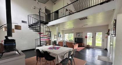 Discover rustic charm at Sunset Oaks, a peaceful 10-acre retreat in North Texas Hill Country. Stay in the Cozy Texas Cabin or Boho Farmhouse, meet friendly animals, and enjoy cozy comforts like a fireplace and jacuzzi tub. Workshops available.