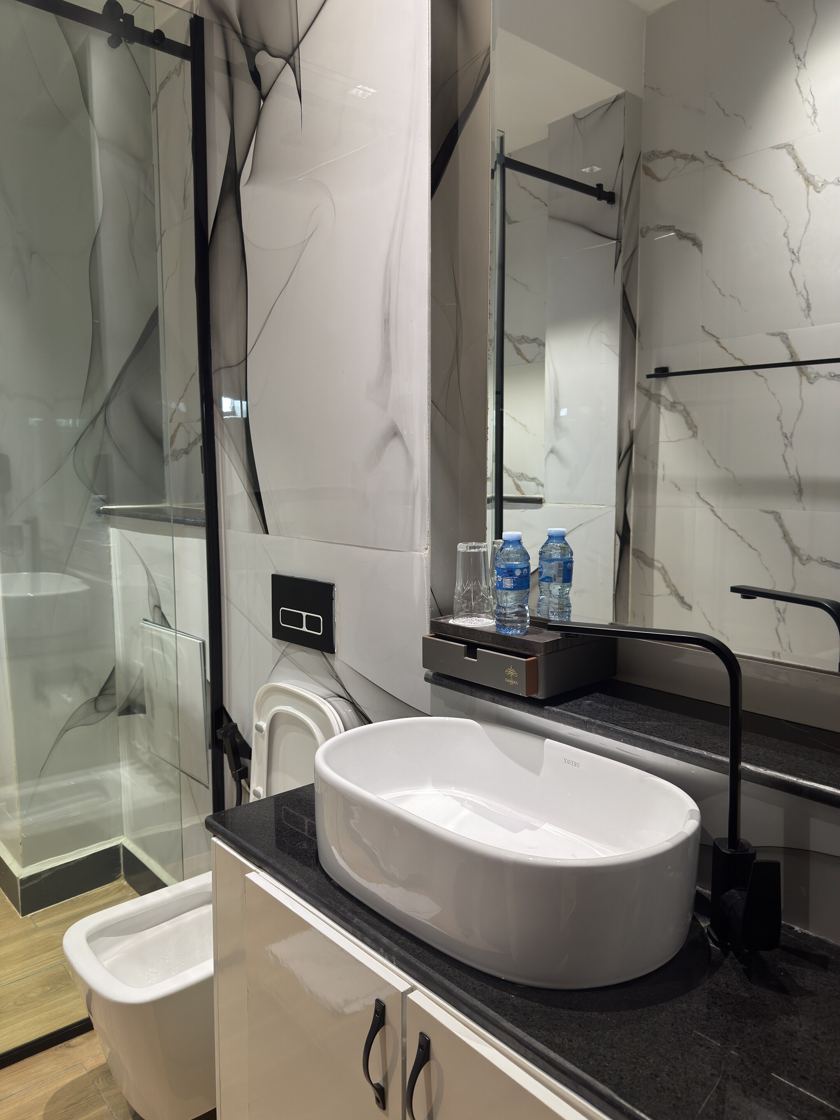 Business Suite, Balcony, City View | Bathroom | Slippers, towels, soap, shampoo