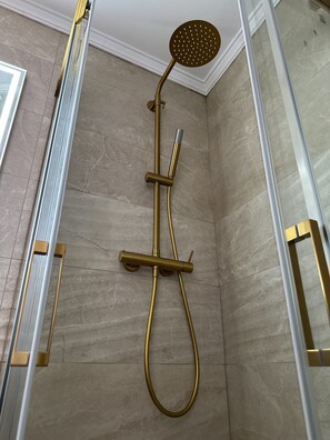 Shower, hair dryer, towels, toilet paper