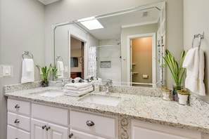A modern bathroom with a large mirror, two sinks, and a vanity with drawers. - 4 Mi to Downtown Panama City: Home w/ Patio! (Panama City)