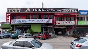 A building with a sign for the Golden Horse Hotel and various other businesses including a food center and a computer store. - Golden Horse Hotel (Johor Bahru)