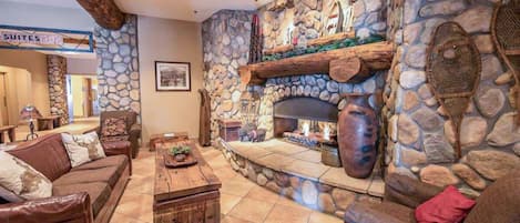 【Lobby Fireplace】Pull up a chair after a ski day — a few steps from your unit