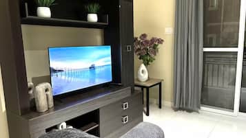 Appartement Confort, patio | Aire de séjour