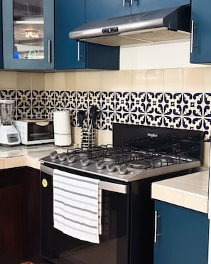 Fridge, microwave, stovetop, coffee/tea maker