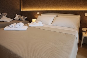 Deluxe Triple Room, Sea View | Desk, laptop workspace, soundproofing, free WiFi