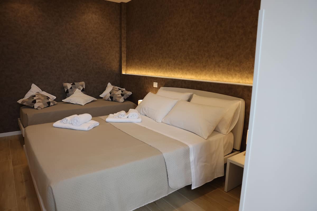 Deluxe Triple Room, Sea View | Desk, laptop workspace, free WiFi