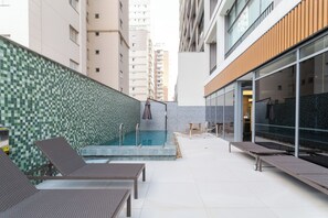 Outdoor pool, open 7:00 AM to 10:00 PM, pool umbrellas, pool loungers