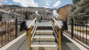 A staircase leading to a building with a view of a snowy mountain and forest. - Cozy Mountain Condo by InvitedHome | In Town, Walkable to Ski / Shops (Telluride)