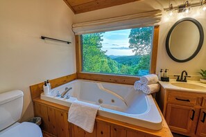Jetted tub, hair dryer, towels, soap