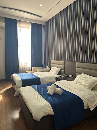 Luxury Twin Room, Courtyard View | In-room safe, desk, blackout drapes, free WiFi