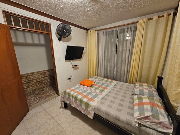 1 bedroom, desk, iron/ironing board, travel crib