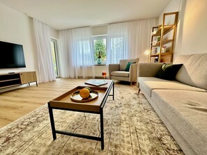 Apartment, 2 Bedrooms, Mountain View, Ground Floor | Living area | 55-inch Smart TV with cable channels - Bergnest Birkenweg (Pfronten)