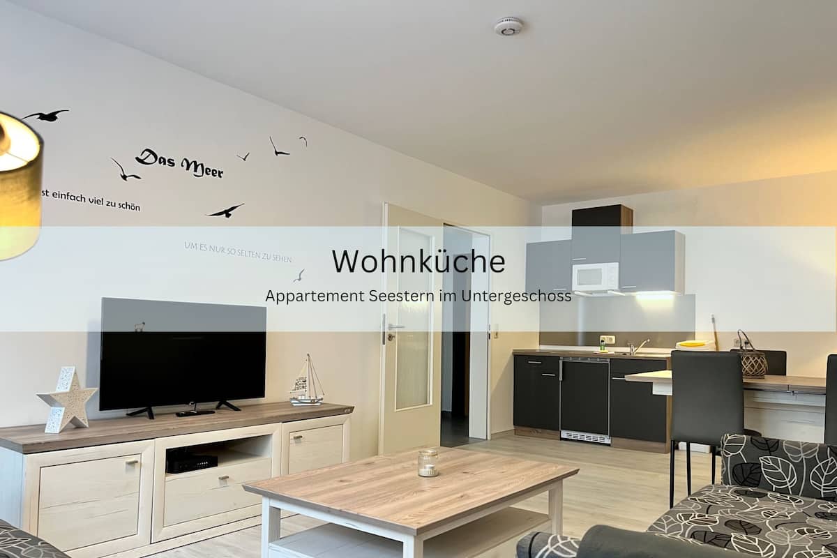 A modern apartment with a living room, kitchen, and dining area.