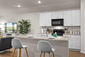 House (4 Bedrooms) | Private kitchen | Microwave, oven, coffee/tea maker, highchair