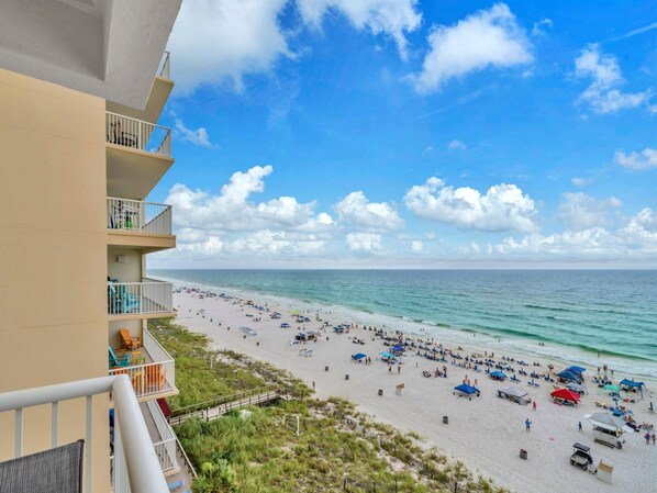 A beach view from an apartment balcony with a clear sky and ocean. - Majestic Beach Towers 1-715 (Panama City Beach)