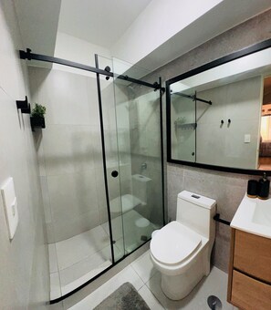 Shower, hair dryer, towels, soap