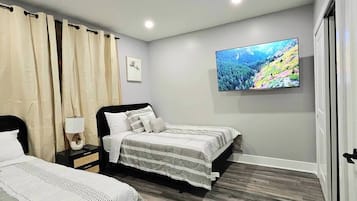 Premium bedding, blackout curtains, iron/ironing board, bed sheets