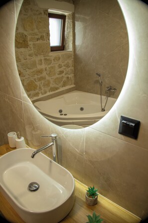 Jetted tub, hair dryer, towels, soap