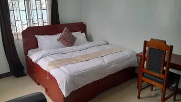 Deluxe Double Room, Garden View | Desk, laptop workspace, free WiFi