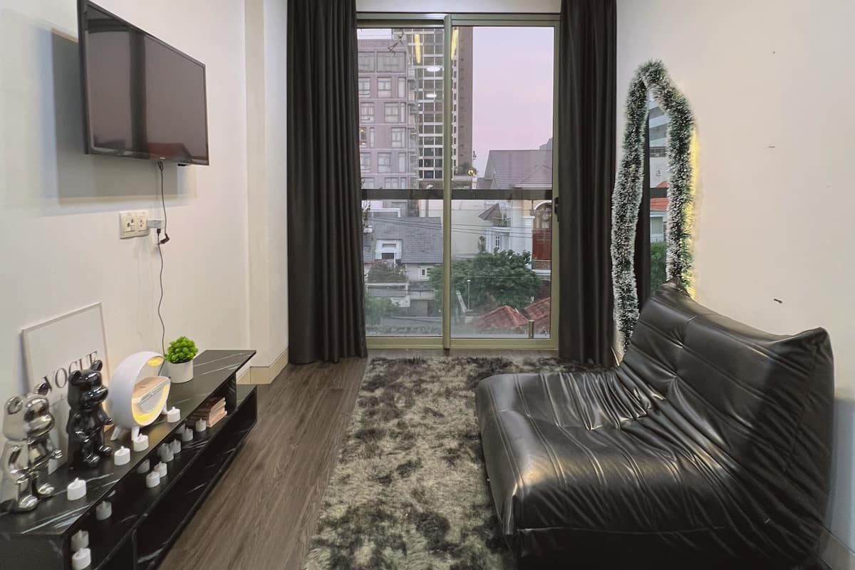 Departamento Deluxe, 1 habitación, vista a la ciudad | Área de sala de estar