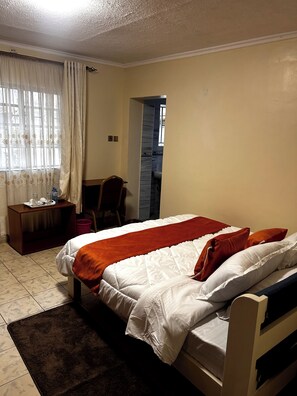 7 bedrooms, in-room safe, desk, iron/ironing board - Experience the perfect blend of comfort and convenience at Axis Guest House. (Machakos)