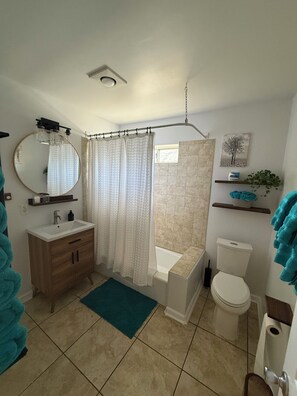 Hair dryer, towels, soap, toilet paper