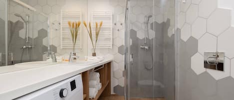 Shower, hair dryer, towels, shampoo