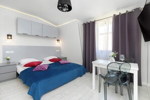 2 habitaciones, tabla de planchar con plancha, cuna de viaje y wifi