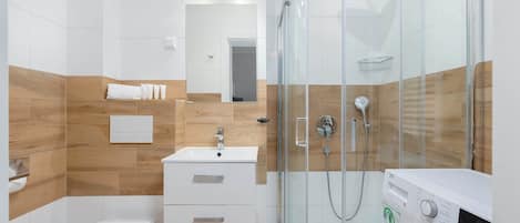 Shower, hair dryer, towels, shampoo