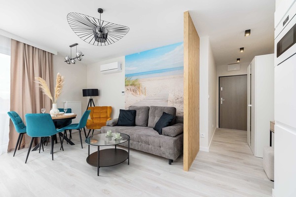 The living room's contemporary decor creates a chic and cozy environment.
