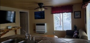 Living area - Knotty Pine Cabin, 5 min to Lake and Ski, in serene Big Bear Lake with WiFi. (Big Bear Lake)