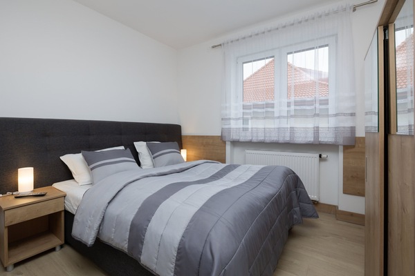 Relax in the elegant living area with a comfortable sofa and cozy decor.