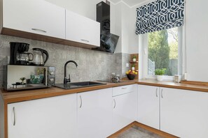 Fridge, microwave, stovetop, coffee/tea maker