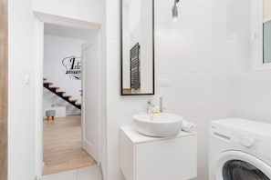 Shower, hair dryer, towels, shampoo