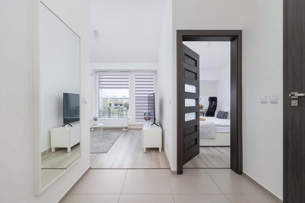 1 bedroom, desk, iron/ironing board, travel crib